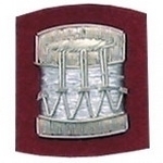 Drum-Badge-Silver-Bullion-on-Red-Badges